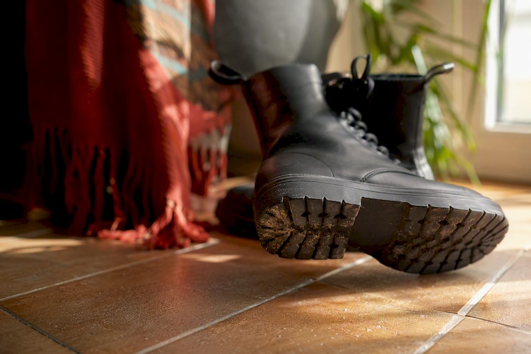 Close-up of vegan boot outsole on hardwood floor