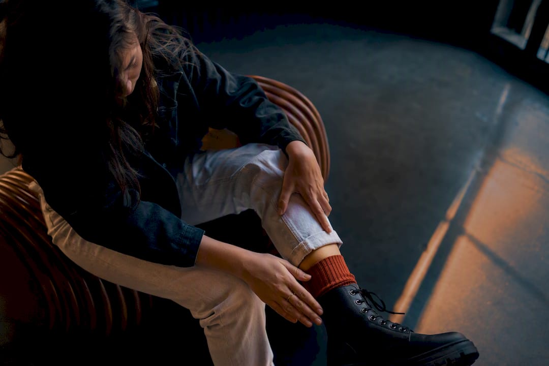Shopper checking combat boot ankle fit