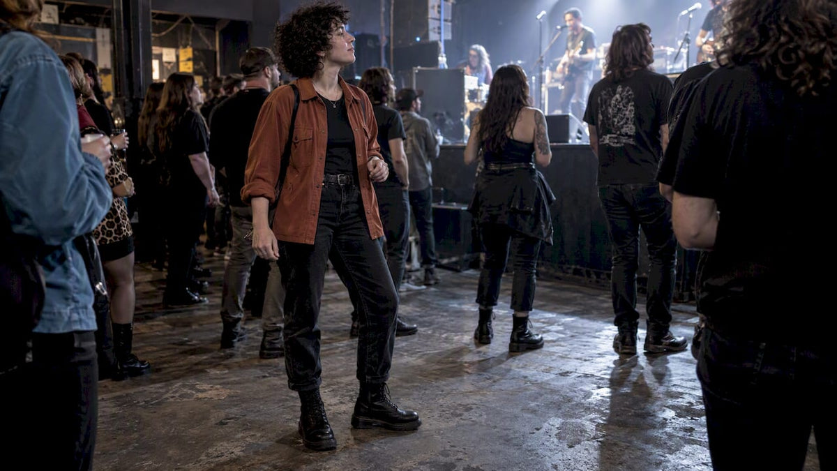 Concertgoer wearing combat boots at a show