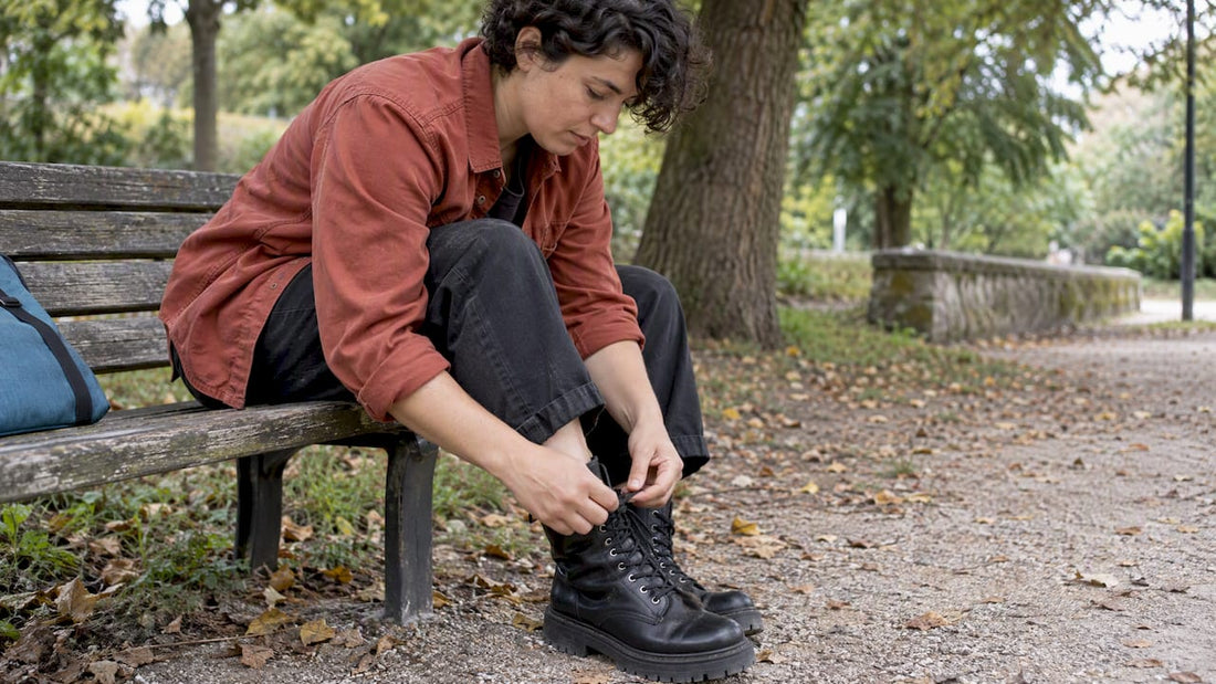 Walker rechecking combat boot laces
